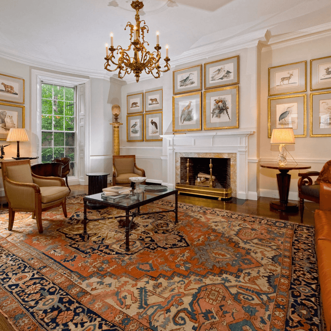 Large 12x15 rug covering a formal living room seating area with a fireplace and classic furniture