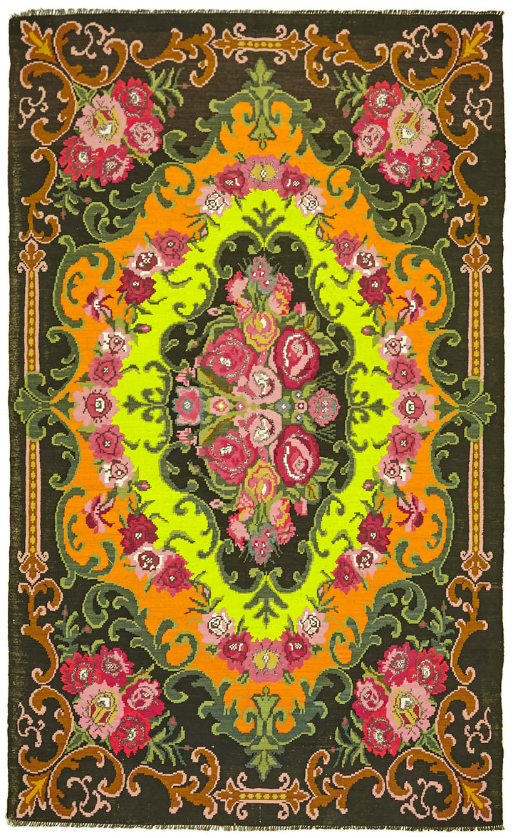 Vintage flatwoven kilim rug with muted colors and handmade woven texture