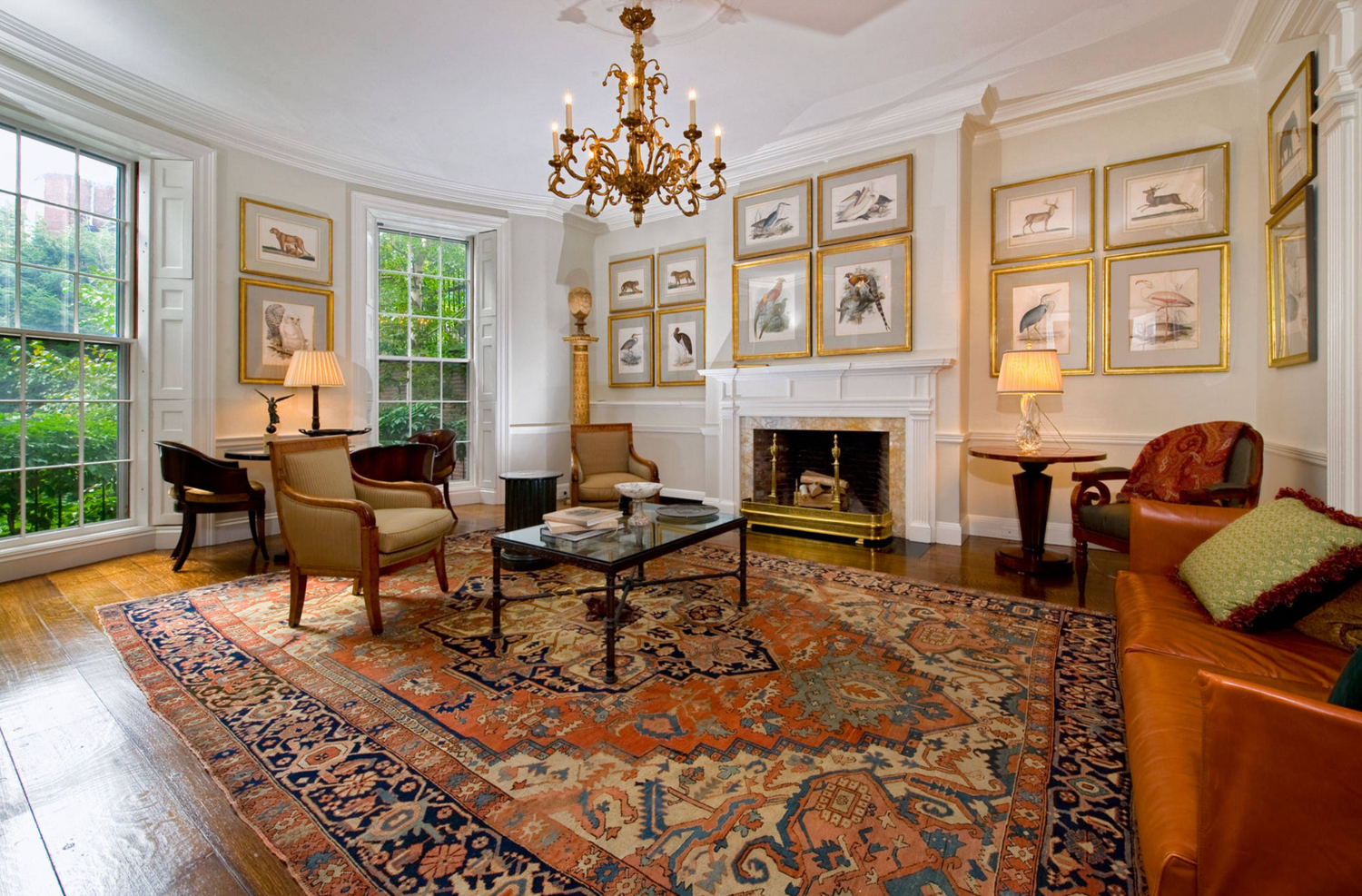 Antique Persian rug displayed in an elegant living room, featuring intricate patterns, rich colors, and timeless handcrafted design.