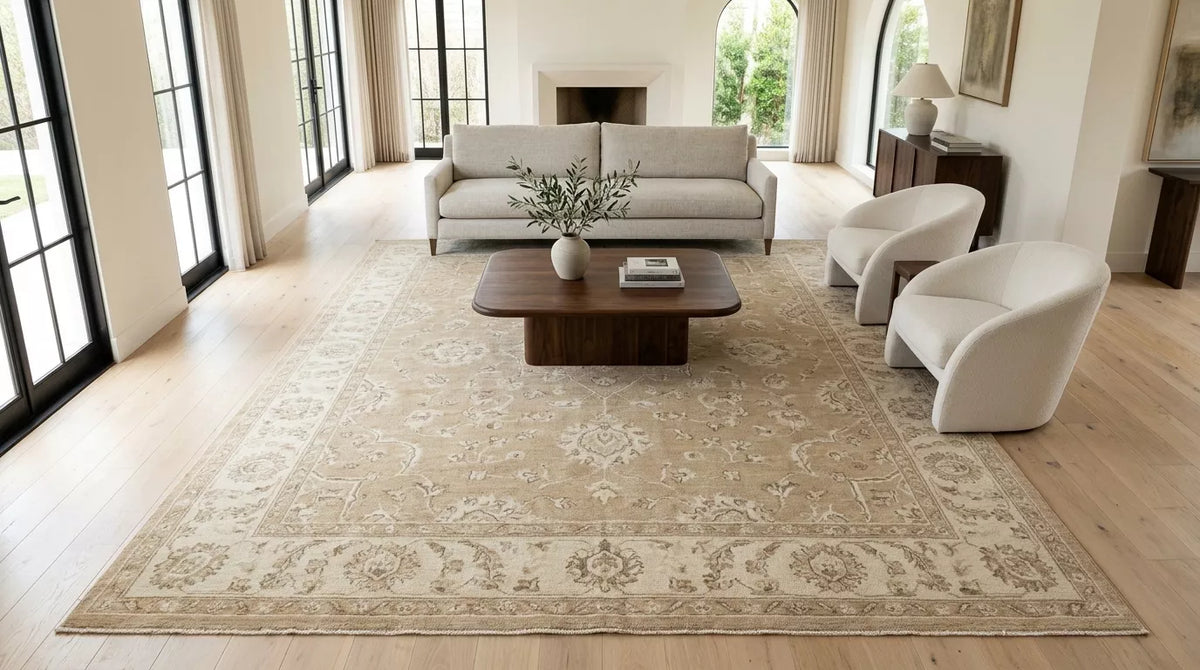 Warm beige vintage Oushak rug in a bright neutral living room
