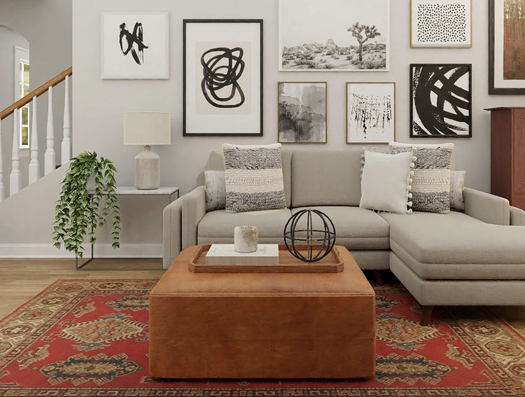 Handmade tribal rug in a neutral living room with patterned cushions, framed artwork and indoor plants