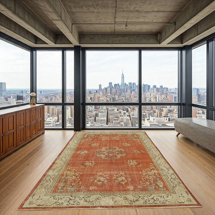 Vintage area rug in a modern city apartment with floor-to-ceiling windows and wooden flooring